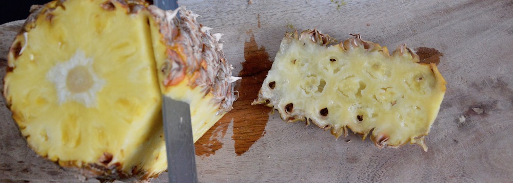 Peeling a pineapple for baby