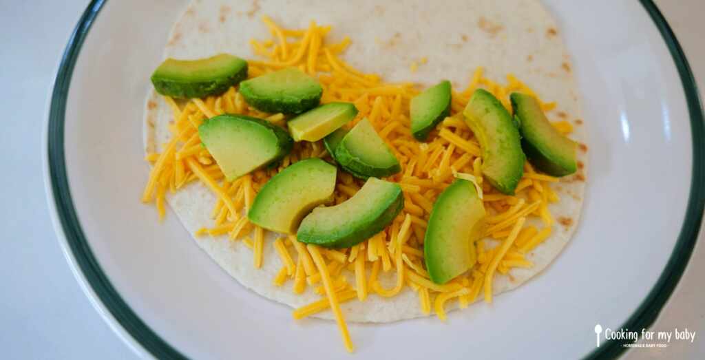 Avocado and cheddar in a tortilla for baby quesadillas