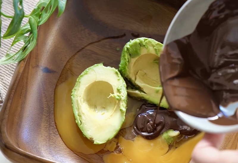 Add the avocado, eggs, and melted chocolate to a mixing bowl