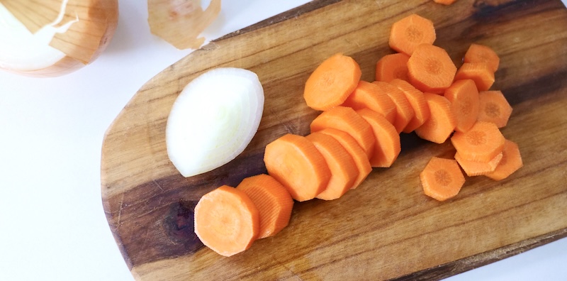 Sliced carrot and onion before cooking