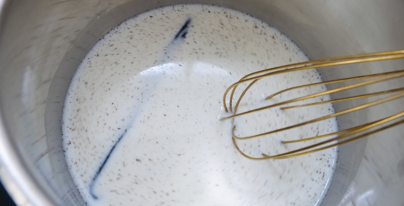 Whisking the milk, cornstarch, and vanilla together