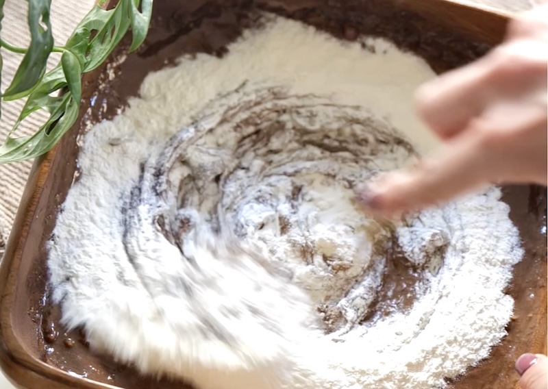 Mix the wet and dry ingredients to make a smooth brownie batter