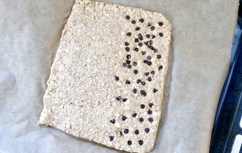 Cereal bar mixture spread on the baking tray