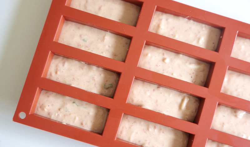 Mini cake molds filled 2/3 with batter