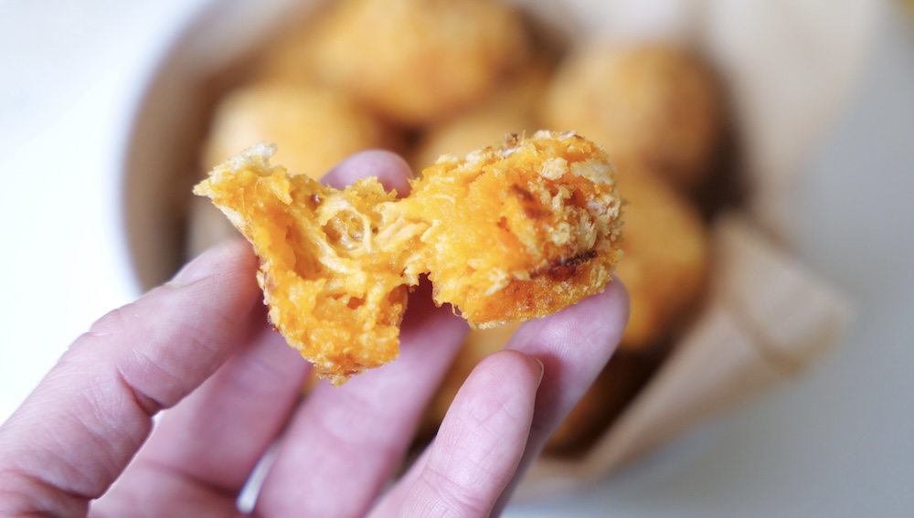 Melted cheddar-style cheese inside sweet potato balls for baby