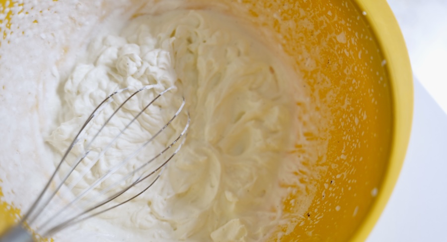 Homemade whipped cream whipped with an electric mixer